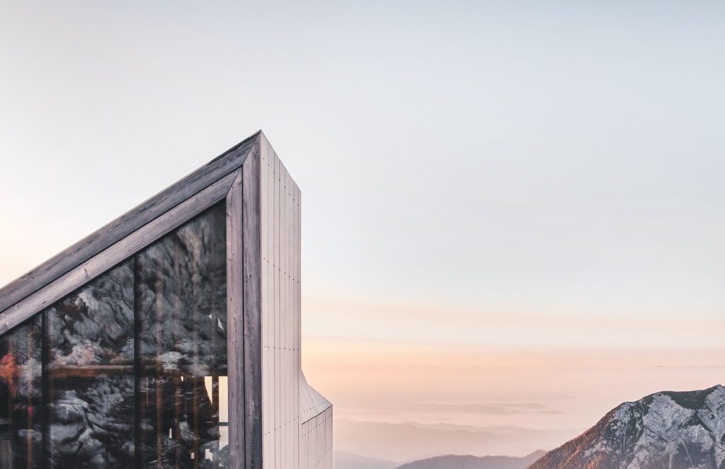 Evening glow behind a contemporary timber building