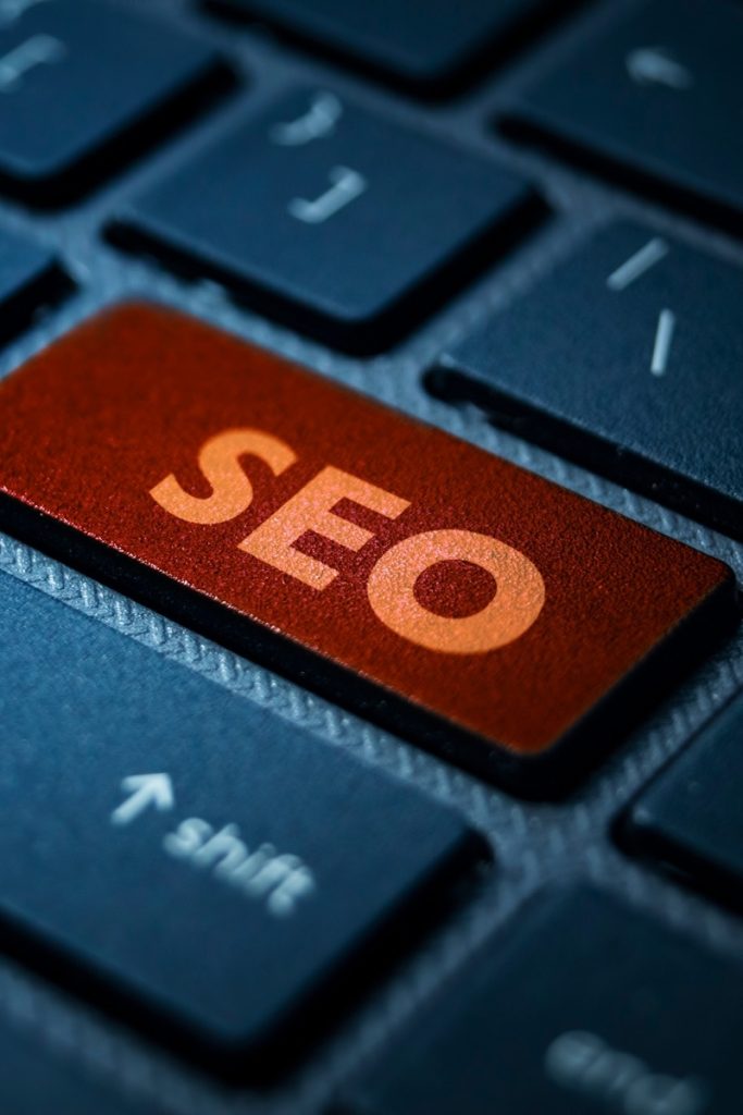 SEO engraved on a vivid orange keyboard key